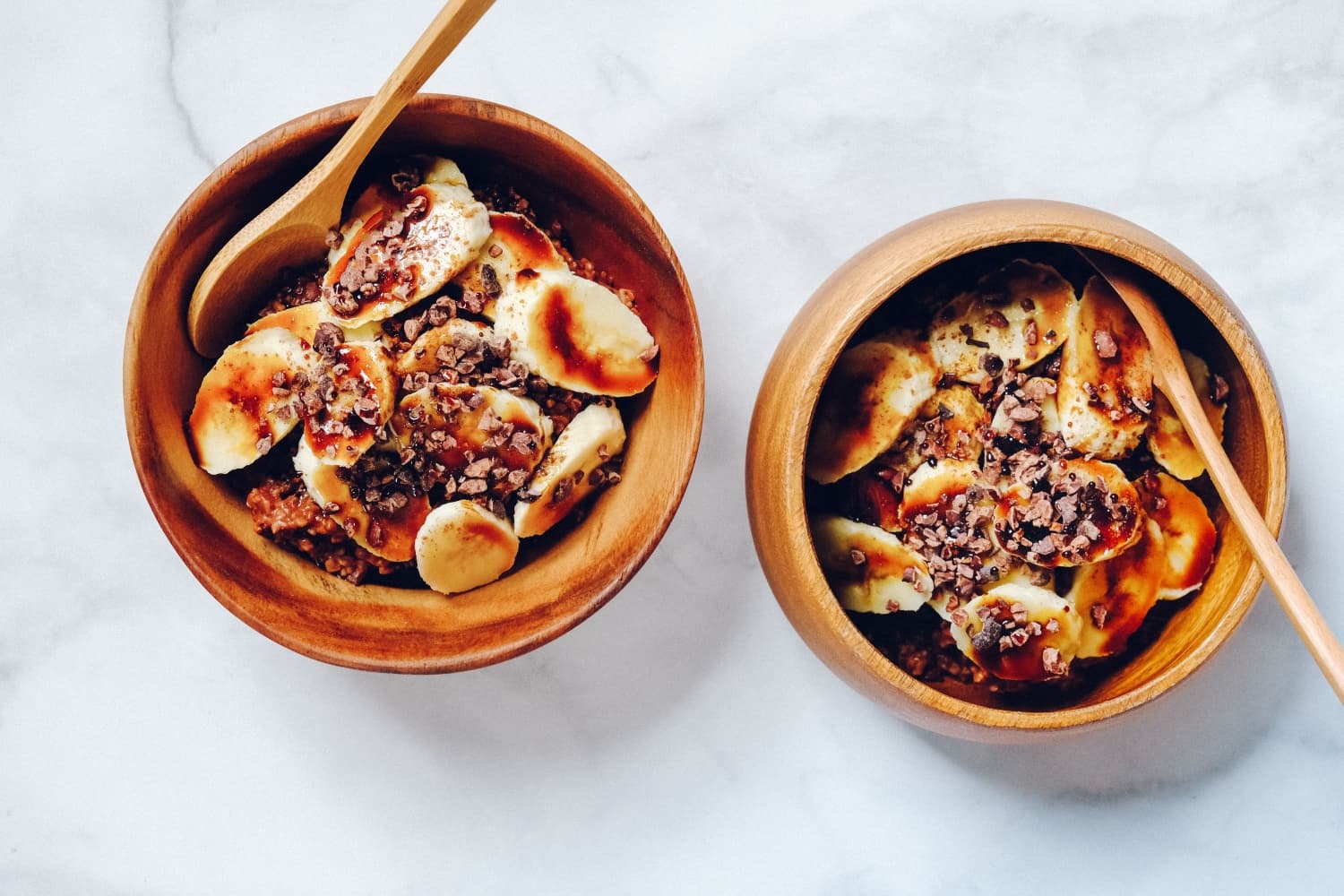 A banana oatmeal breakfast bowl with cacao nibs